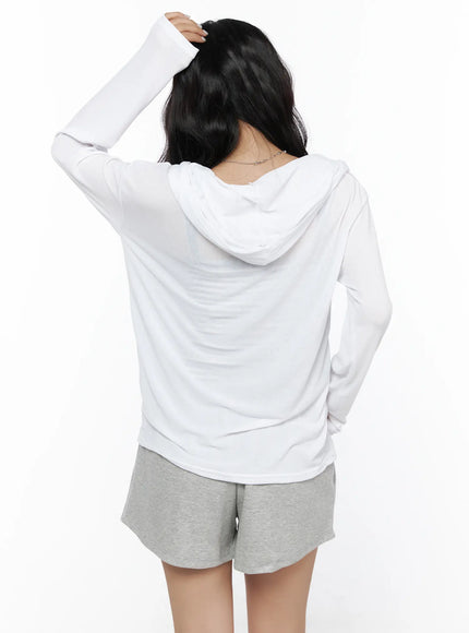 Button-Up Sheer Hoodie Top CL513 White back view model hand in hair showing hood drape smooth sheer fabric back panel and long sleeve fit