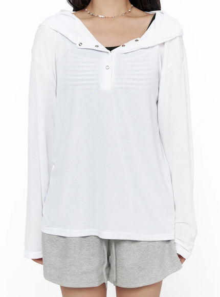 Button-Up Sheer Hoodie Top CL513 White close-up front crop shot showing silver snap buttons hood collar sheer stripe texture and drawstring detail