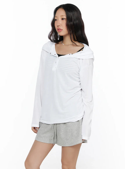 Button-Up Sheer Hoodie Top CL513 White three-quarter side view on model showing snap button neckline hood drape and subtle stripe texture of sheer fabric