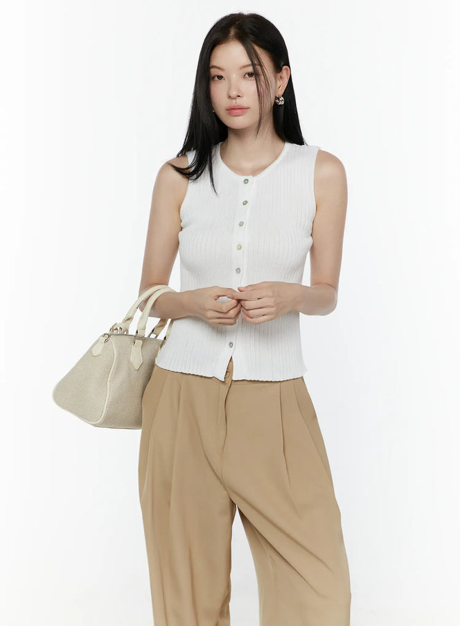 LEWKIN Button-Up Tank Top IL506 White S/M front view on model wearing beige wide-leg trousers and carrying cream bag, ribbed knit