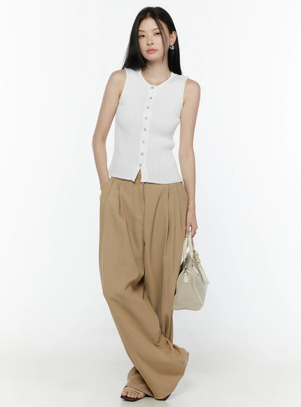 Button-Up Tank Top IL506 White full-body front shot on model standing upright holding bag at side, styled with khaki wide-leg pants