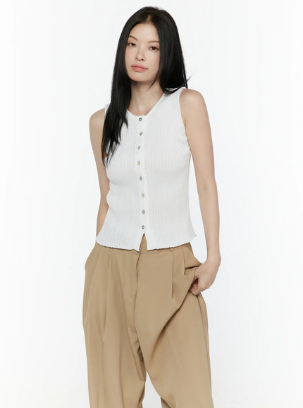 Button-Up Tank Top IL506 White three-quarter front shot on model with hand in pocket, ribbed sleeveless top with iridescent buttons