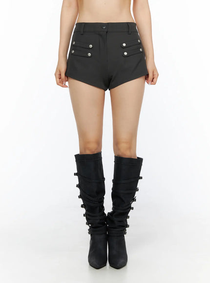 Buttoned Military High Waist Shorts CL502 Dark gray front shot on model showing symmetric silver snap button pocket flaps, high waist, and asymmetric hem