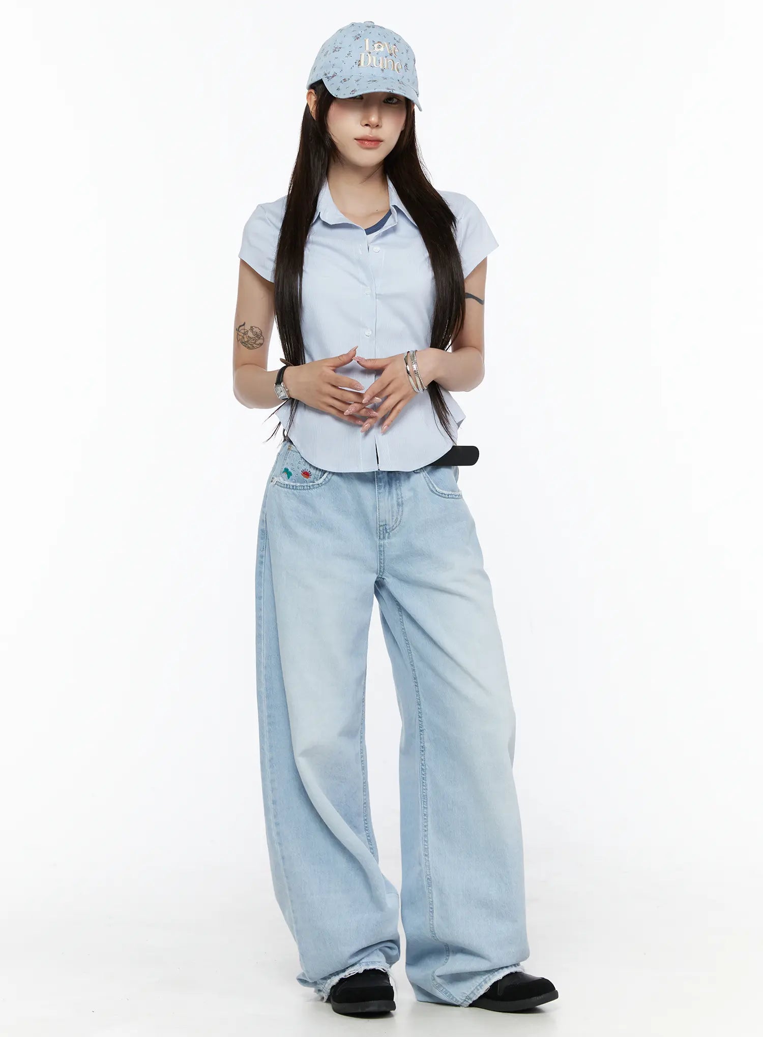 Camden Flower Ball Cap IL503 light blue full-body model shot styled with blue pinstripe shirt and wide-leg light wash jeans, front-facing casual outfit