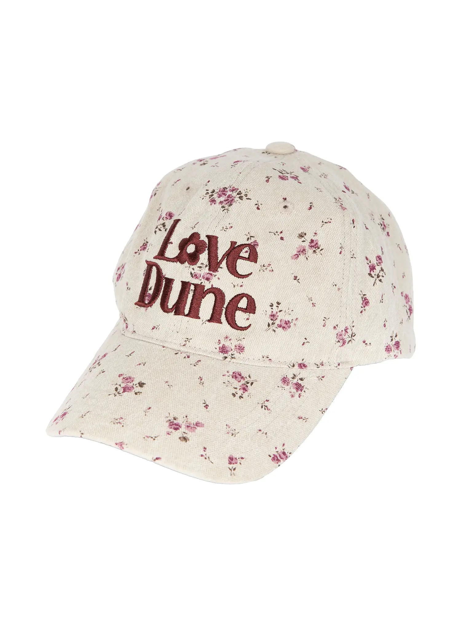 Camden Flower Ball Cap IL503 cream angled product shot showing three-quarter front view, burgundy Love Dune embroidery and pink ditsy floral pattern on structured cap