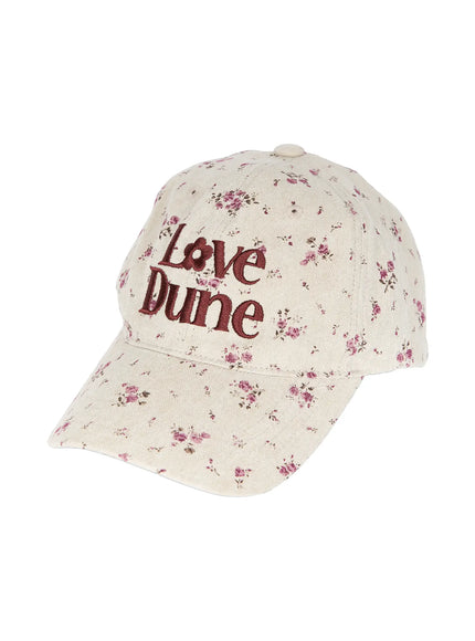 Camden Flower Ball Cap IL503 cream angled product shot showing three-quarter front view, burgundy Love Dune embroidery and pink ditsy floral pattern on structured cap