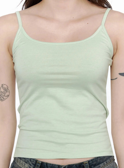 Cami Tank Top IL506 Mint close-up detail shot on model showing scoop neckline, thin spaghetti straps, and soft ribbed cotton texture against bare shoulders
