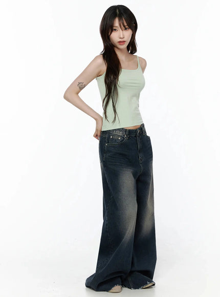Cami Tank Top IL506 Mint side shot on model with hand on hip, showing cropped length and form-fitting ribbed fabric, paired with wide-leg dark wash jeans