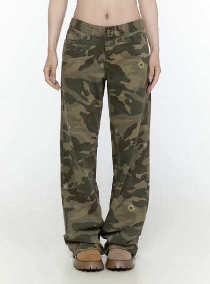 LEWKIN Camo Cargo Trousers IL522 Dark green front view on model wearing cropped white graphic tee and belt, wide-leg low-rise camo pants with floral print