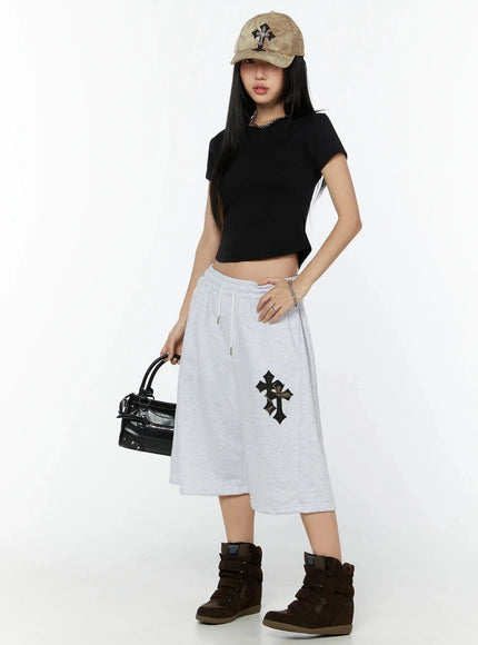 Camo Cross Patch Bermuda Shorts IU524 Light gray full-body front shot on model styled with black crop tee, tan cap, black bag and brown wedge sneakers