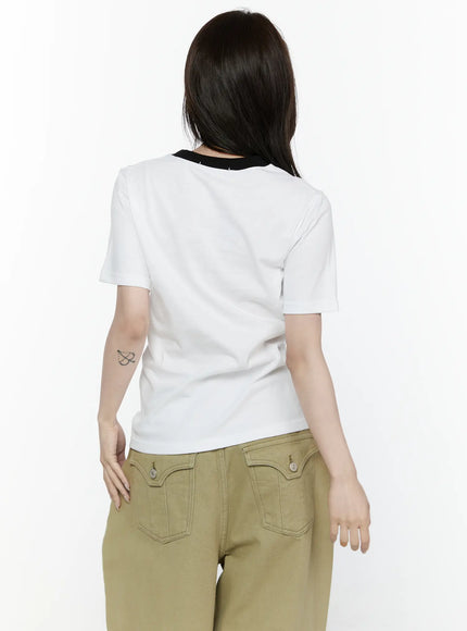 Camo Graphic T-Shirt IL522 White back shot on model showing plain white cotton back with black ringer neckline short sleeves paired with khaki wide-leg pants