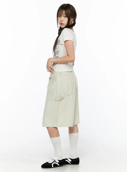 Cargo Bermuda Shorts CL514 Light beige side full-body shot on model with graphic tee, showing back cargo pocket and knee-length hem