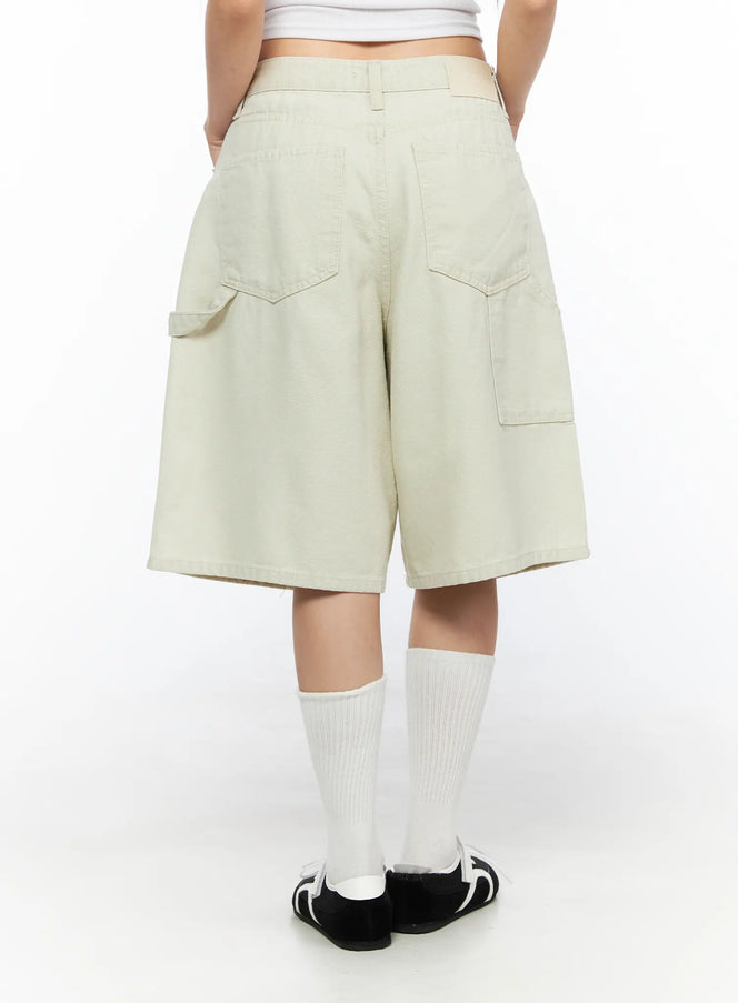 Cargo Bermuda Shorts CL514 Light beige back shot on model showing dual back pockets and wide-leg silhouette with white knee-high socks