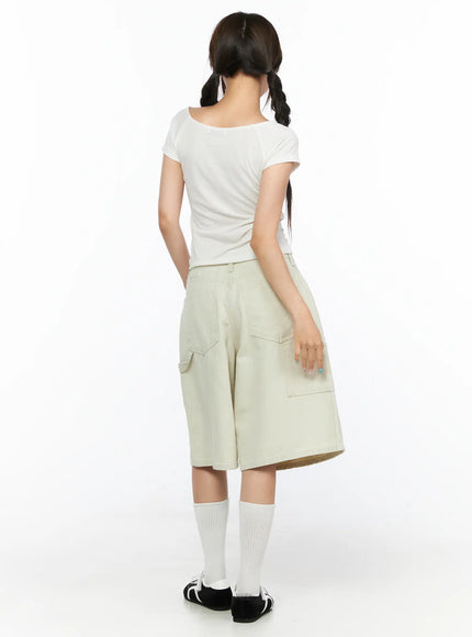 Cargo Bermuda Shorts CL514 Light beige back full-body shot on model with white tee, featuring dual cargo pockets and relaxed wide-leg cut