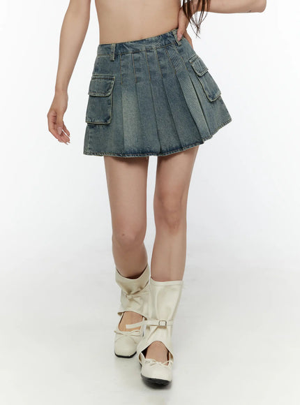 LEWKIN Cargo Pleated Vintage Wash Denim Skirt CL507 Blue front close-up on model walking showing pleated denim and dual cargo pockets with white boots