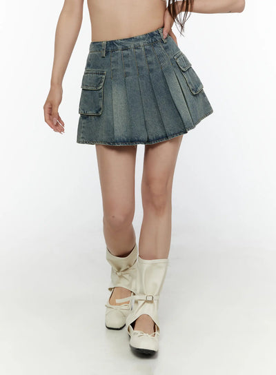 LEWKIN Cargo Pleated Vintage Wash Denim Skirt CL507 Blue front close-up on model walking showing pleated denim and dual cargo pockets with white boots