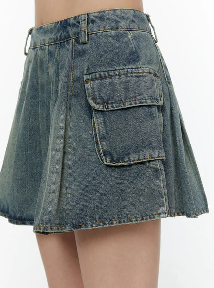Cargo Pleated Vintage Wash Denim Skirt CL507 Blue side close-up detail on model highlighting large cargo pocket flap and vintage wash denim texture