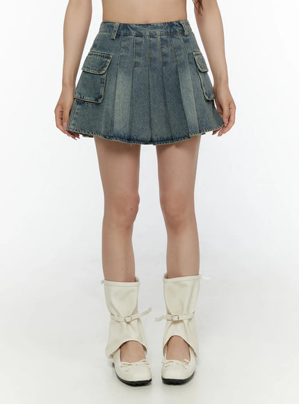 Cargo Pleated Vintage Wash Denim Skirt CL507 Blue front shot on model standing straight showing dual cargo pockets pleats and vintage wash denim with white boots