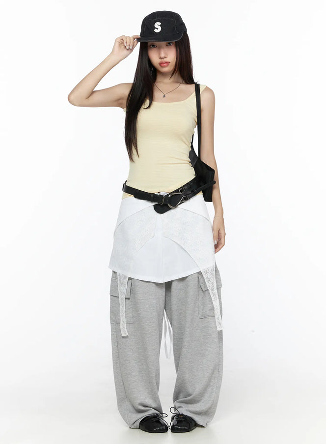 Cargo Wide Leg Sweatpants CL524 Gray full-body front shot on model styled with yellow tank top black cap crossbody bag and belt over white wrap skirt layered look