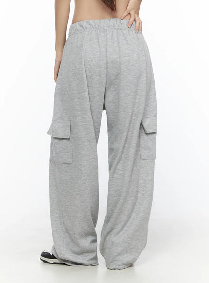 Cargo Wide Leg Sweatpants CL524 Gray back shot on model cropped at waist hands on lower back showing rear elastic waistband and dual back cargo flap pockets