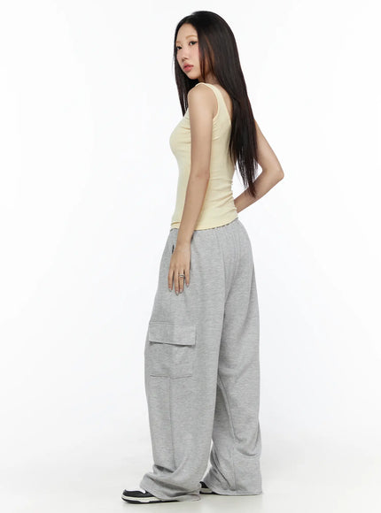 Cargo Wide Leg Sweatpants CL524 Gray full-body side shot on model in yellow tank top glancing over shoulder showing side cargo pocket and wide-leg drape silhouette