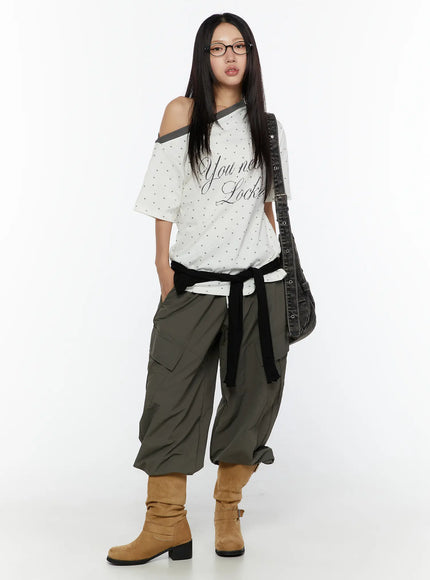 Cargo Wide Parachute Pants CU526 Dark gray full-body styled shot on model wearing glasses with graphic tee black belt tie and tan boots