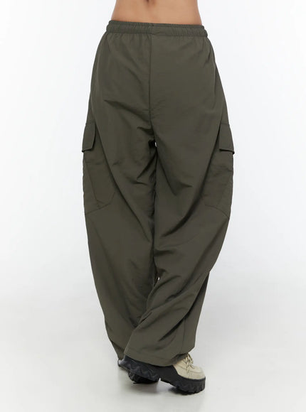 Cargo Wide Parachute Pants CU526 Dark gray back shot on model showing rear cargo pockets wide dropped crotch and gathered hem with chunky sneakers