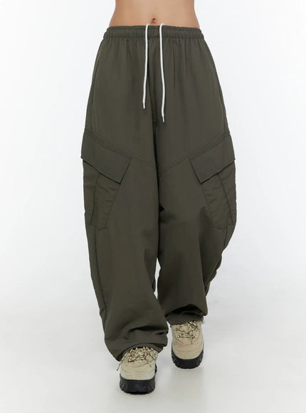Cargo Wide Parachute Pants CU526 Dark gray front crop shot on model showing white drawstring elastic waistband angular cargo pockets and wide balloon leg