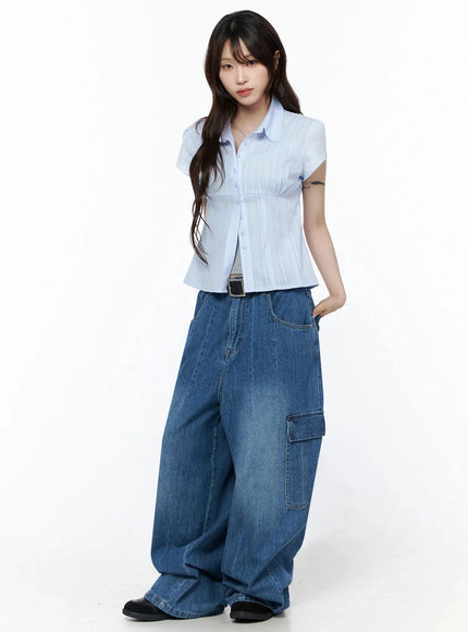 Carla Wide Cargo Jeans IL506 Blue three-quarter front shot on model in light blue striped shirt and black belt, slightly angled relaxed pose