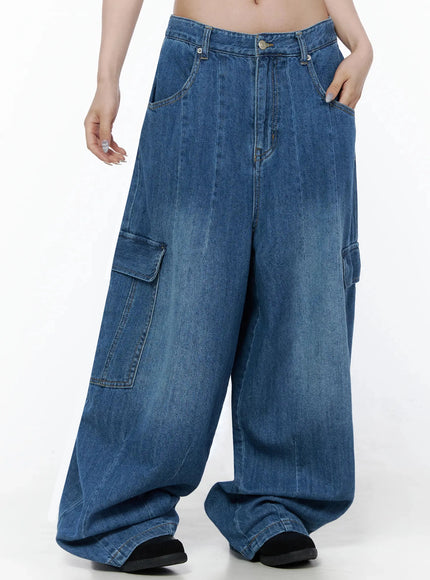 Carla Wide Cargo Jeans IL506 Blue front close-up on model showing waistband, front pockets, pintuck crease, and cargo flap pocket with faded wash