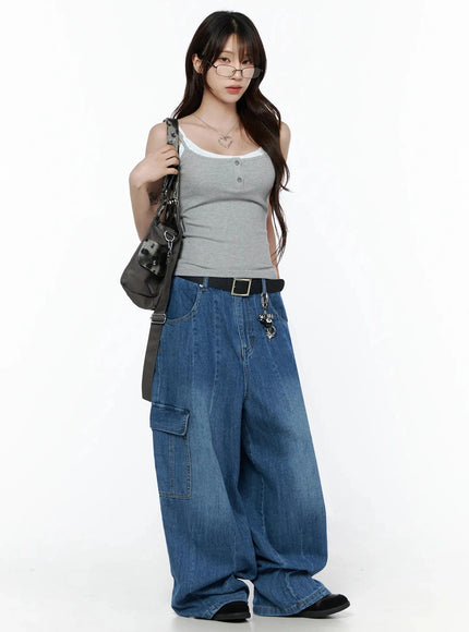Carla Wide Cargo Jeans IL506 Blue full-body front shot on model styled with gray tank top, glasses, and shoulder bag, showing oversized wide-leg fit