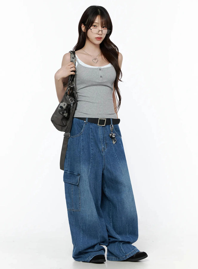 Carla Wide Cargo Jeans IL506 Blue full-body front shot on model styled with gray tank top, glasses, and shoulder bag, showing oversized wide-leg fit