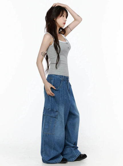 Carla Wide Cargo Jeans IL506 Blue side shot on model hand on hip showing wide-leg silhouette and side cargo pocket detail with faded wash