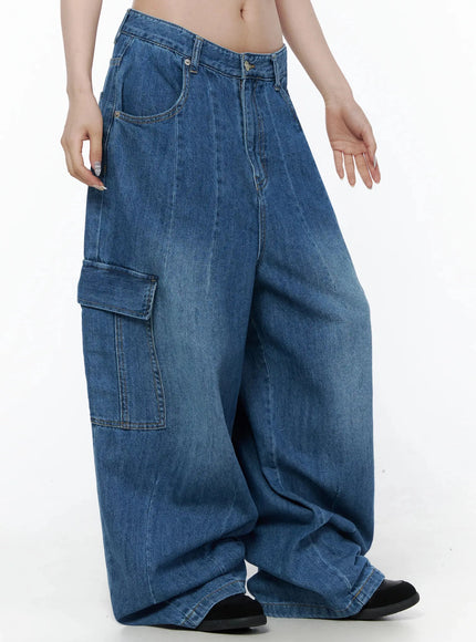 Carla Wide Cargo Jeans IL506 Blue side close-up on model showing left cargo flap pocket, pintuck seam, and faded wash on ultra-wide leg