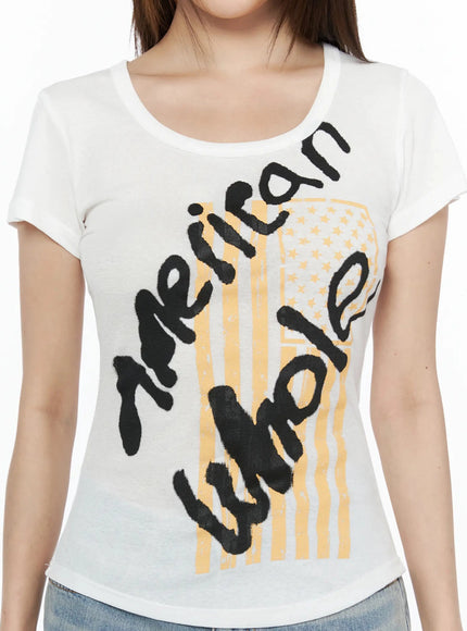 Casual Graphic Short Sleeve Tee IL523 White close-up detail shot showing black graffiti lettering and yellow American flag graphic print on scoop neckline