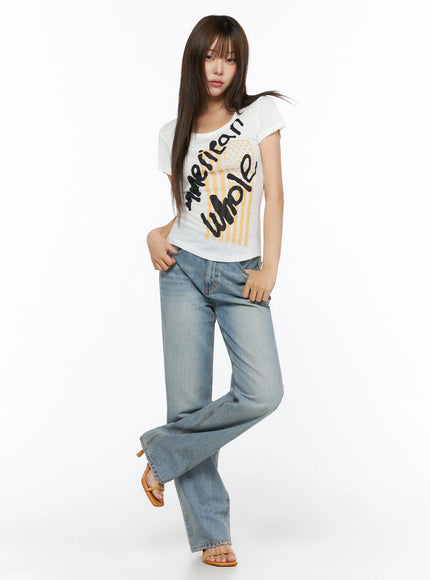 Casual Graphic Short Sleeve Tee IL523 White full-body front shot on model with dynamic pose hands in jeans pockets styled with wide-leg denim and tan sandals