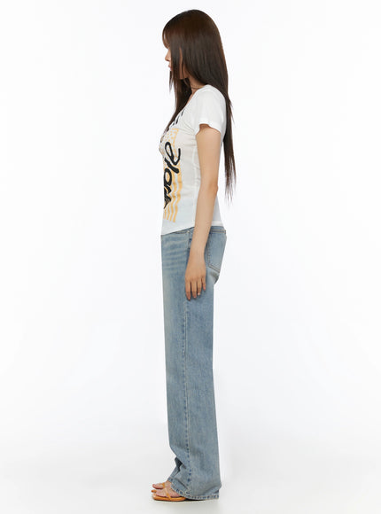 Casual Graphic Short Sleeve Tee IL523 White full-body side shot on model showing slim silhouette short sleeve length and body-skimming fit with wide-leg denim