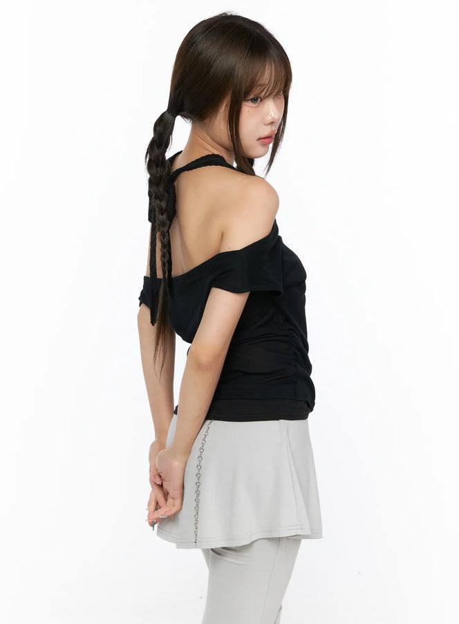 Casual Layered Halter Top CL517 Black side shot on model showing off-shoulder drape open back halter detail with ruched knit fabric