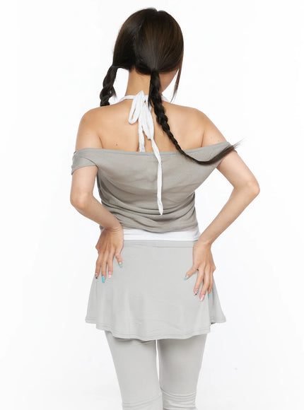Casual Layered Halter Top CL517 Beige close-up back shot on model hands on hips showing draped off-shoulder knit and white halter tie at center back