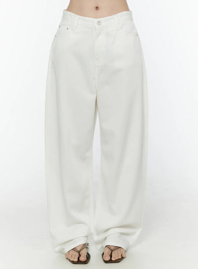 LEWKIN Casual Low-Rise Wide Leg Cotton Pants IL506 White front close-up on model showing V-shaped waistband, button closure, and wide-leg silhouette with thong sandals