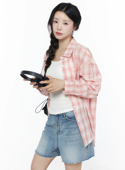 LEWKIN Casual Plaid Button-Up Shirt IU525 Pink S/M three-quarter shot model holding headphones open over white tank top layered with denim shorts