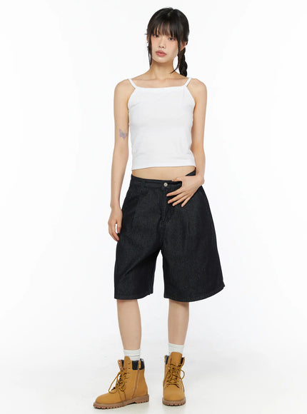 Casual Sleeveless Top CU530 White full-body front shot on model standing upright, cropped spaghetti-strap top styled with dark denim shorts and tan lace-up boots