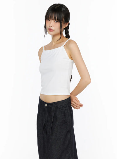 LEWKIN Casual Sleeveless Top CU530 White side shot on model wearing braided pigtails, cropped ribbed camisole with thin straps paired with dark denim