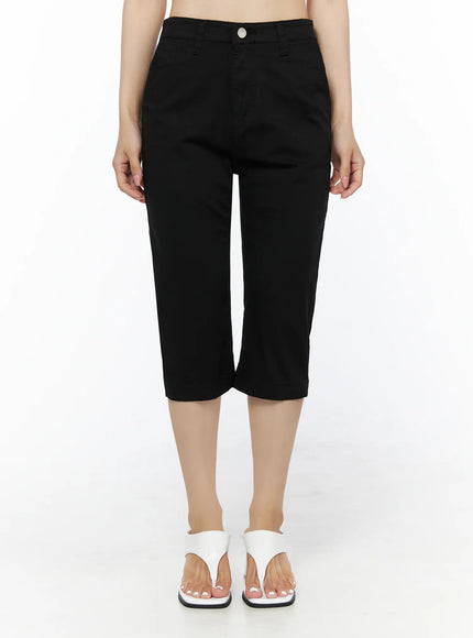 LEWKIN Casual Slim-Fit Capri Pants IU525 Black front view on model standing upright showing high-rise waist, silver button closure, and cropped length