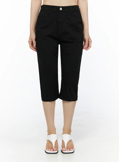 LEWKIN Casual Slim-Fit Capri Pants IU525 Black front view on model standing upright showing high-rise waist, silver button closure, and cropped length