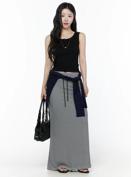 Casual Striped Drawstring Maxi Skirt IU525 White full-length front shot on model styled with black tank top, navy cardigan tied at waist and black bag