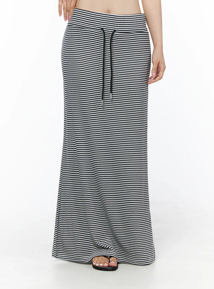 Casual Striped Drawstring Maxi Skirt IU525 White front waist-down shot on model showing black drawstring tie and flared maxi hem with flip flop sandals