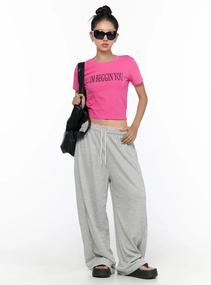Casual Wide Leg Sweatpants CL513 Gray front full-body shot on model hand on hip paired with pink crop tee and black shoulder bag