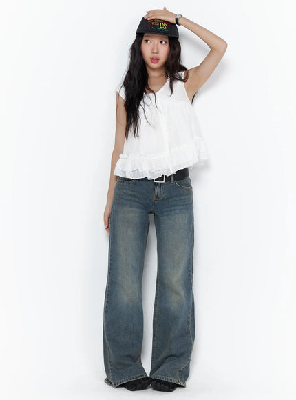 LEWKIN Cedar Vintage Wash Low-Rise Straight Jeans CL510 blue denim full-length front shot on model styled with white ruffle top and black cap, one hand raised