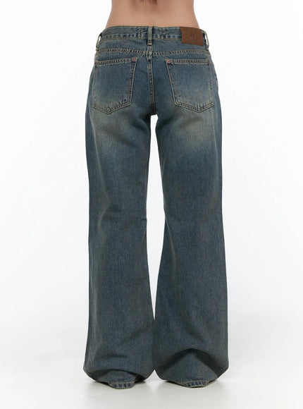 Cedar Vintage Wash Low-Rise Straight Jeans CL510 blue denim back close-up detail shot showing two back pockets, brown leather brand patch, contrast stitching and faded wash